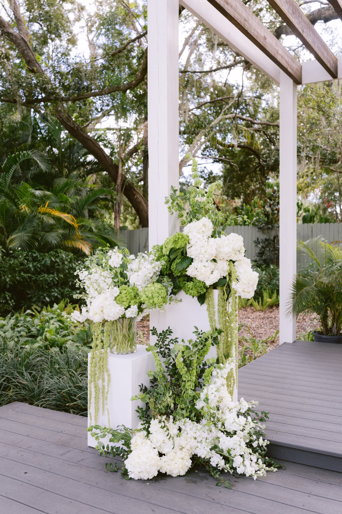 White hydrangeas and green florals create elegant ceremony decor by Ava Elise Decor at Soire Estate Tampa wedding
